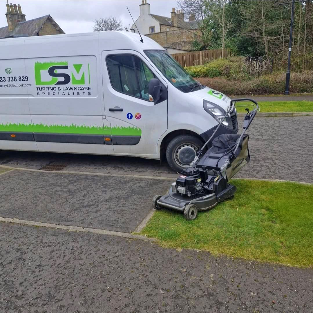 DSM van and mower on the drive at a maintenance visit