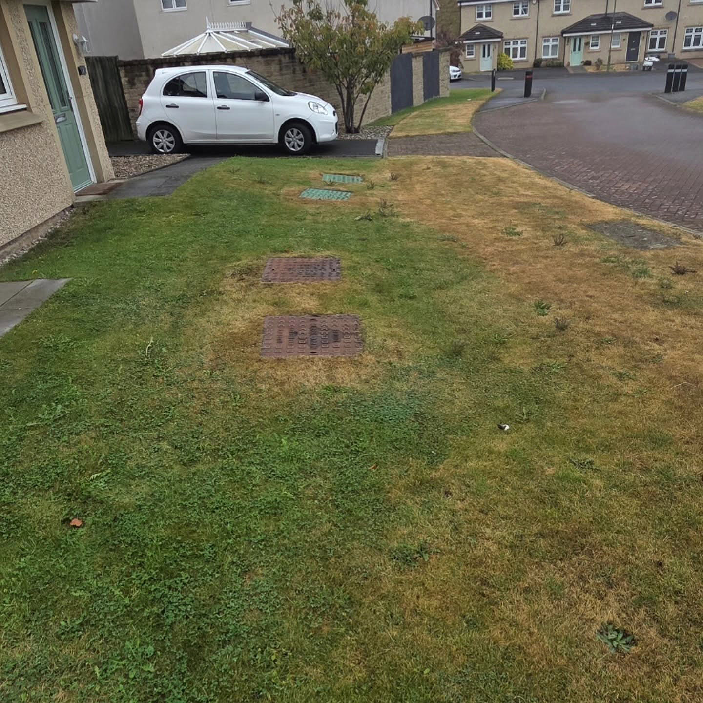 Patchy, weed-filled lawn in Prestonpans before its DSM renovation in September