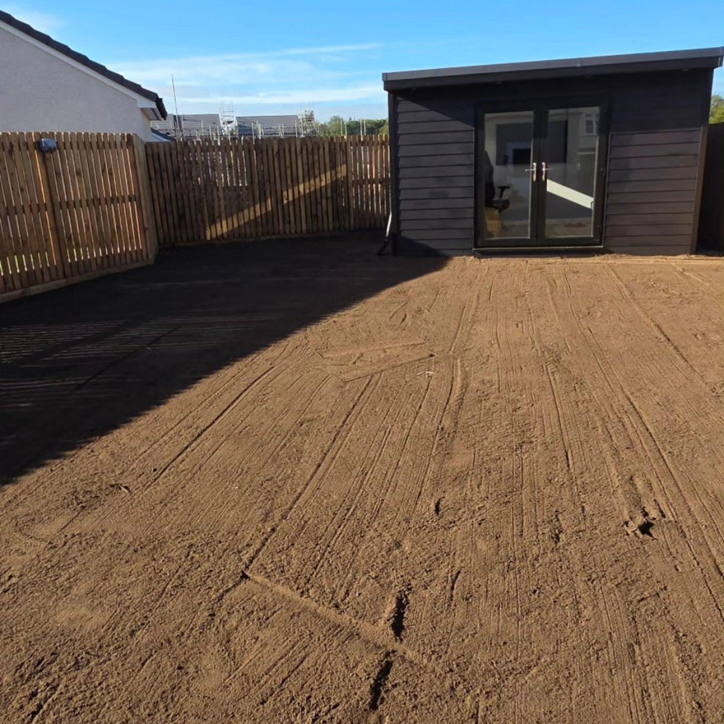 Turfing before: ground raked and prepared