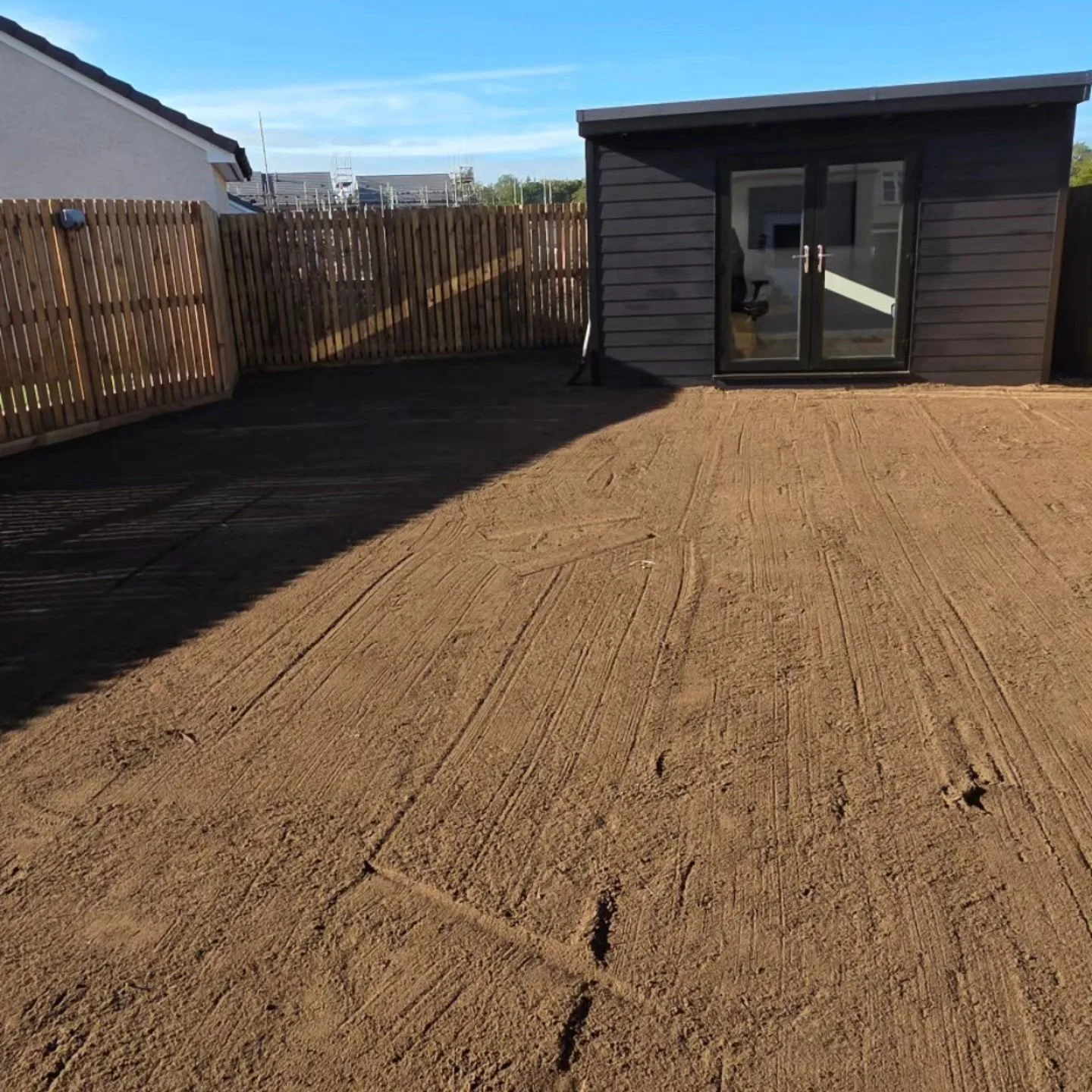 Turfing before: ground raked and prepared