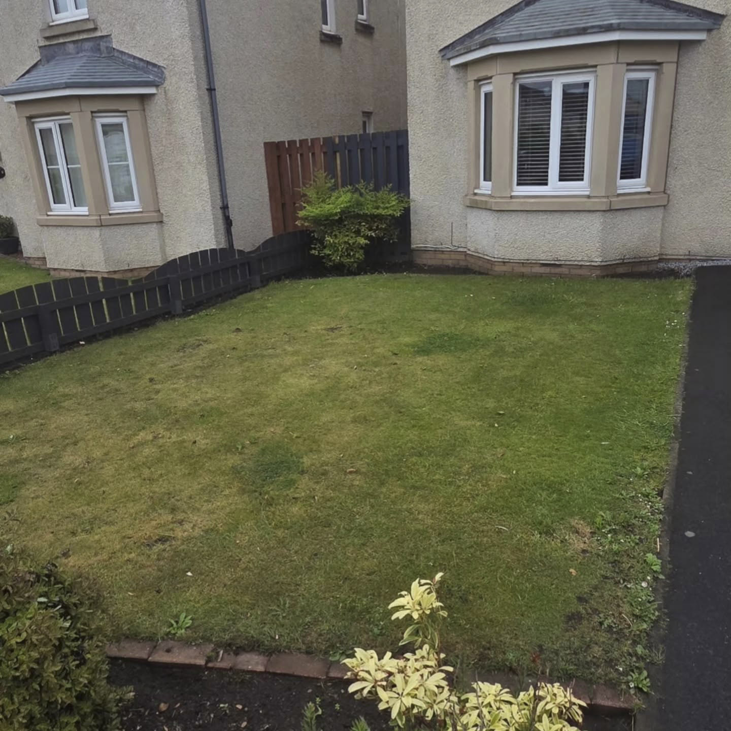 Patchy, uneven front lawn in Prestonpans, thin and weedy before DSM took it on