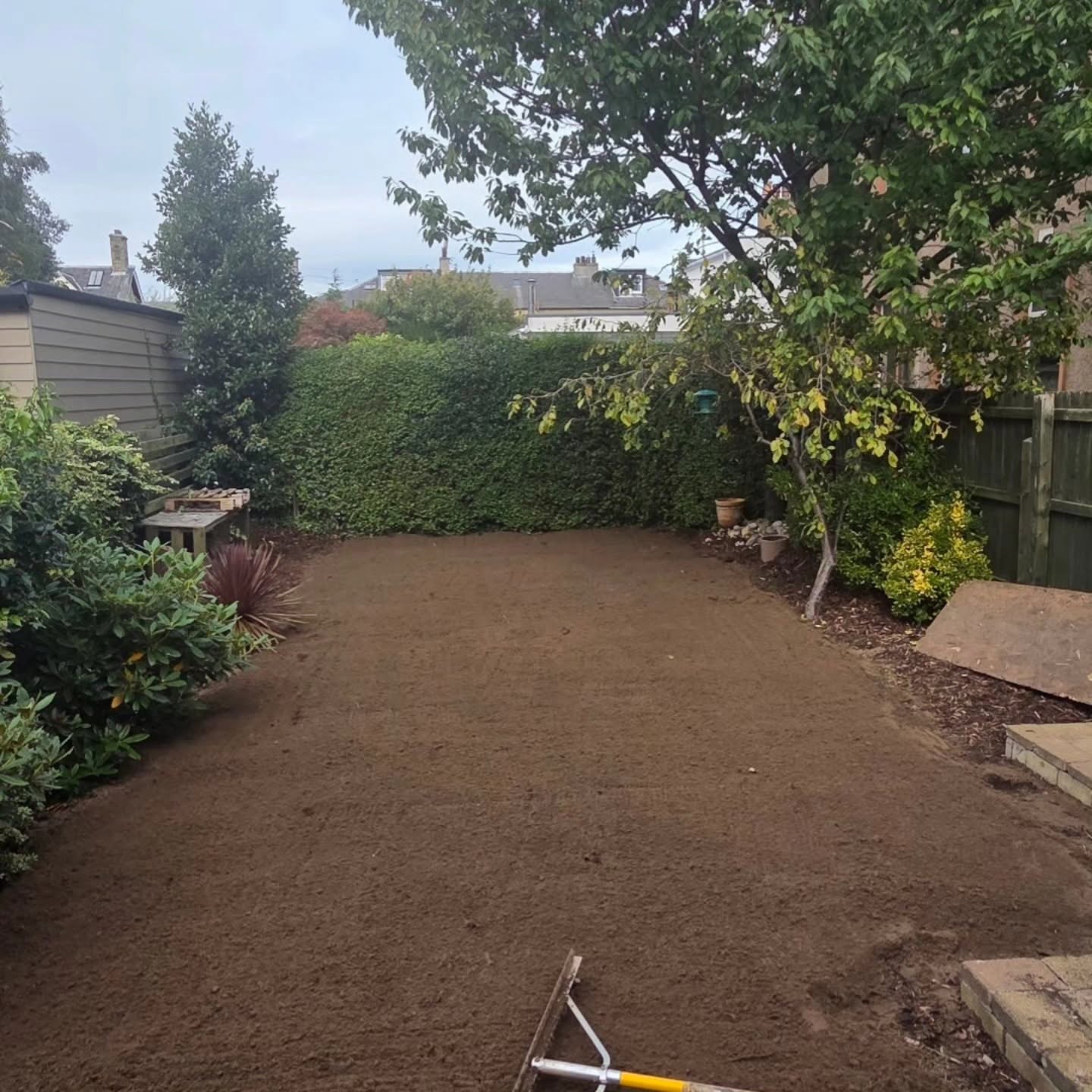About 4 tonnes of rootzone levelled across the Trinity garden, ready for turf